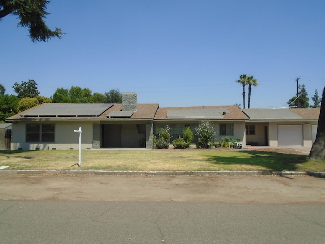 935 S Park Circle Dr, Fresno, CA 93727 - ranch-style home with solar panels, a garage, a front lawn, and stucco siding