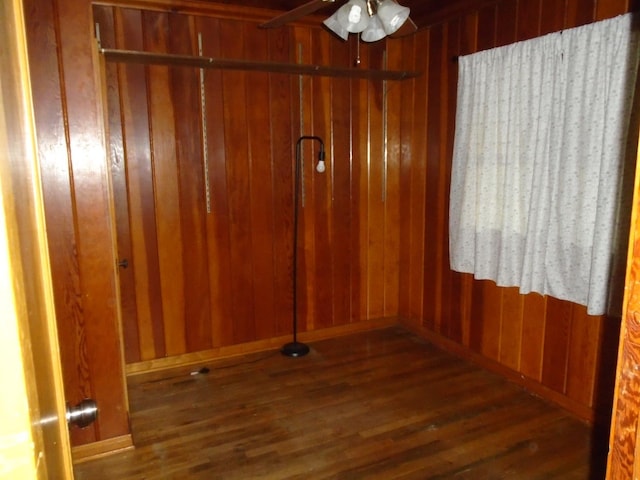 935 S Park Circle Dr, Fresno, CA 93727 - spare room featuring a ceiling fan, wood finished floors, and wooden walls