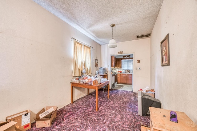 25 W Dinuba Ave, Fresno, CA 93706 - office area with a textured ceiling and carpet floors