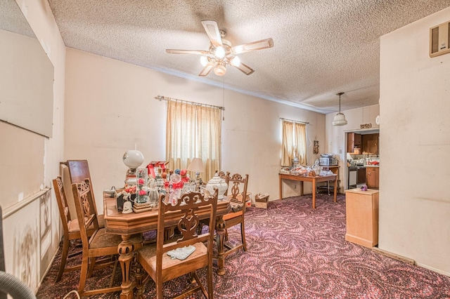 25 W Dinuba Ave, Fresno, CA 93706 - carpeted dining area featuring a textured ceiling and a ceiling fan