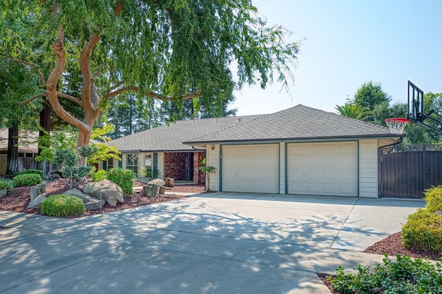 591 E Warwick Ave, Fresno, CA 93720 - ranch-style home featuring concrete driveway and a shingled roof