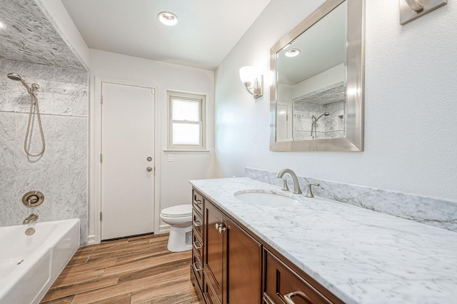 591 E Warwick Ave, Fresno, CA 93720 - bathroom featuring vanity, wood finished floors, and bathing tub / shower combination