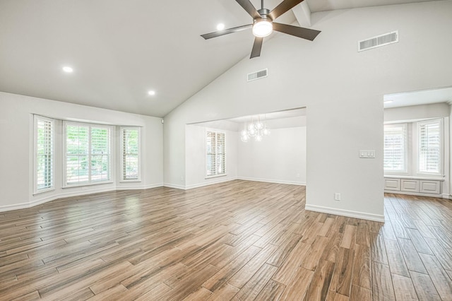 591 E Warwick Ave, Fresno, CA 93720 - unfurnished living room featuring high vaulted ceiling, a chandelier, ceiling fan, light wood-type flooring, and beamed ceiling