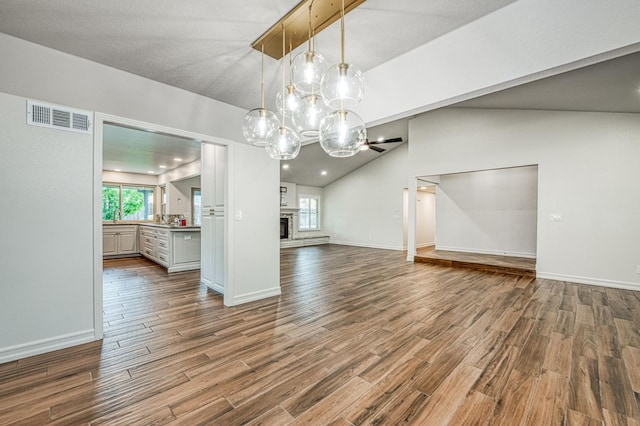591 E Warwick Ave, Fresno, CA 93720 - spare room with plenty of natural light, lofted ceiling, wood finished floors, and ceiling fan