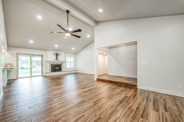 591 E Warwick Ave, Fresno, CA 93720 - unfurnished living room featuring beamed ceiling, a ceiling fan, wood finished floors, a fireplace with raised hearth, and high vaulted ceiling