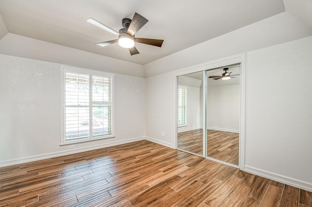 591 E Warwick Ave, Fresno, CA 93720 - unfurnished bedroom with wood finished floors, a closet, and ceiling fan