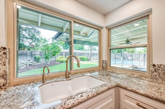 591 E Warwick Ave, Fresno, CA 93720 - kitchen view of white cabinets and light stone counters