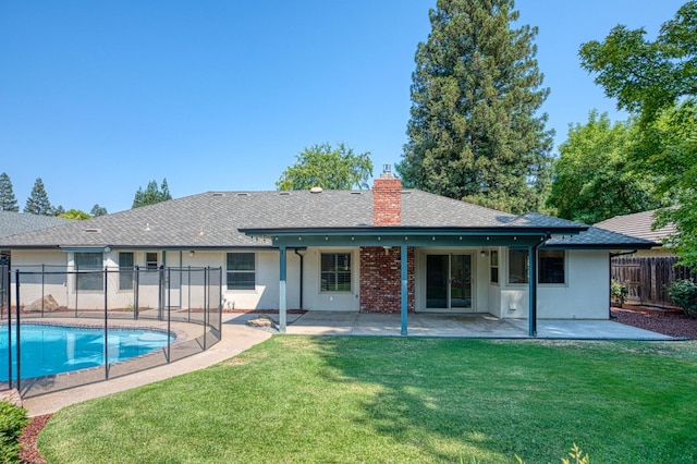 591 E Warwick Ave, Fresno, CA 93720 - back of property featuring roof with shingles, a chimney, and a patio area