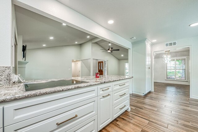 591 E Warwick Ave, Fresno, CA 93720 - bathroom with vanity, healthy amount of natural light, wood finished floors, a ceiling fan, and recessed lighting