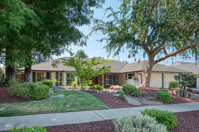 591 E Warwick Ave, Fresno, CA 93720 - single story home featuring a garage and a shingled roof