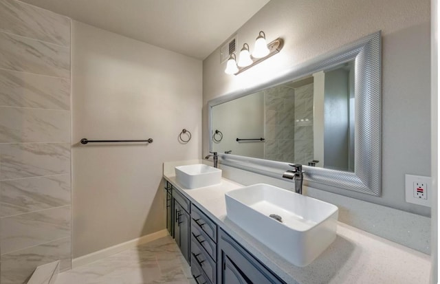 6236 N Bond St, Fresno, CA 93710 - bathroom with marble look tile flooring and double vanity