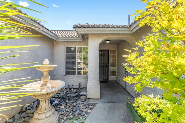 539 Chablis Ave, Madera, CA 93637 - property entrance featuring stucco siding and a tile roof