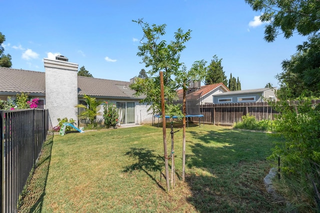 539 Chablis Ave, Madera, CA 93637 - fenced backyard featuring a trampoline