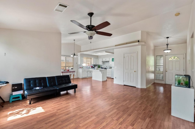 539 Chablis Ave, Madera, CA 93637 - living area with a ceiling fan, light wood-style floors, and healthy amount of natural light
