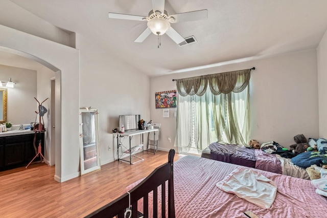 539 Chablis Ave, Madera, CA 93637 - bedroom featuring arched walkways, light wood-type flooring, and ceiling fan