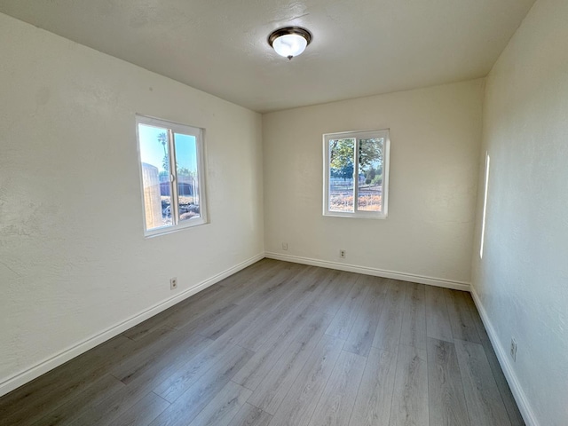 1741 N Blythe Ave, Fresno, CA 93722 - empty room with wood finished floors and baseboards