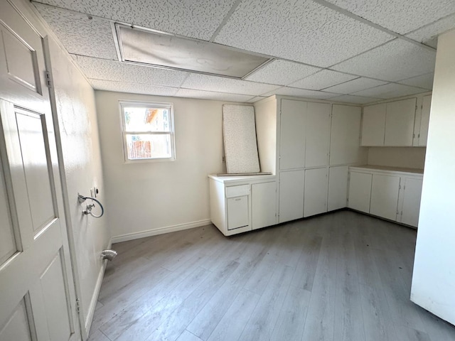 1741 N Blythe Ave, Fresno, CA 93722 - below grade area featuring light wood finished floors and a paneled ceiling