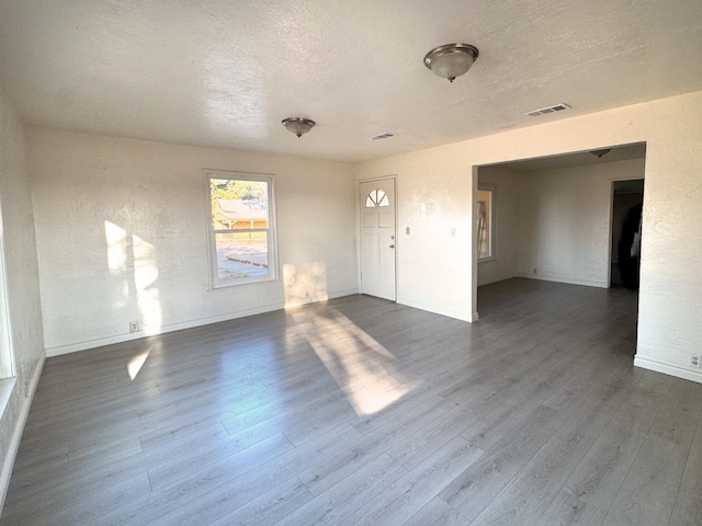 1741 N Blythe Ave, Fresno, CA 93722 - unfurnished room with dark wood-style flooring and a textured ceiling