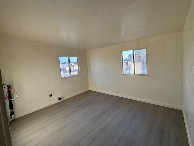 1741 N Blythe Ave, Fresno, CA 93722 - unfurnished room with dark wood-style floors and baseboards