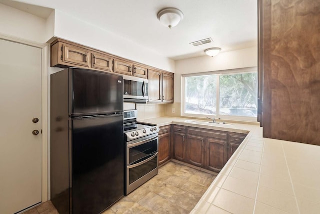 31736 Apache Rd, Coarsegold, CA 93614 - kitchen with stainless steel appliances and tile countertops