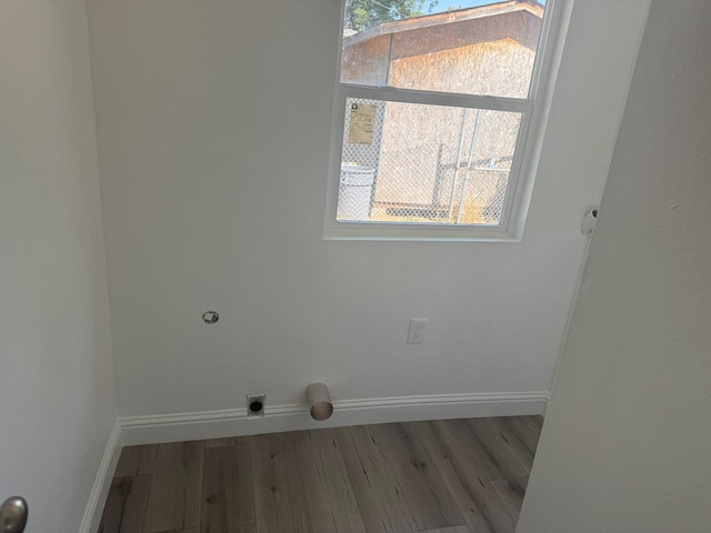 3852 E Thomas Ave, Fresno, CA 93702 - laundry room with electric dryer hookup, wood finished floors, and plenty of natural light