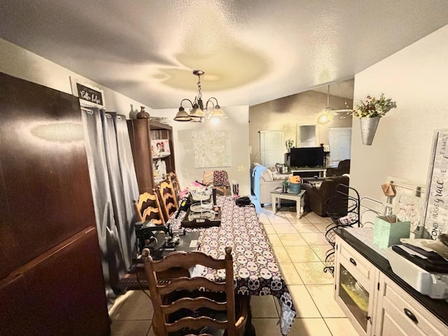 3315 Dewey Ave, Fresno, CA 93722 - dining area with a chandelier, light tile patterned floors, and a textured ceiling