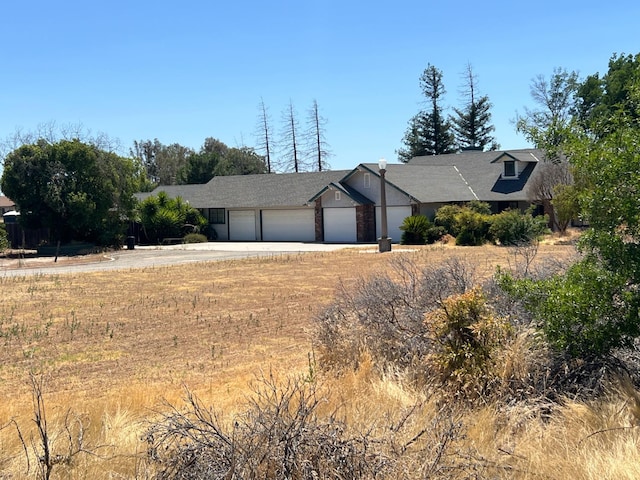 16564 Monreal Rd, Madera, CA 93636 - view of front of property with an attached garage and driveway