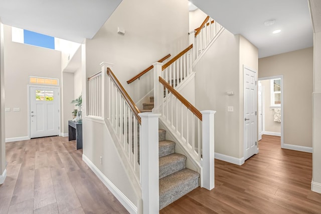 2234 E Serena Ave, Fresno, CA 93720 - stairs featuring wood finished floors, a towering ceiling, and recessed lighting