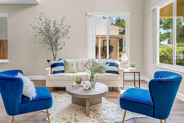 2234 E Serena Ave, Fresno, CA 93720 - living area featuring plenty of natural light and wood finished floors