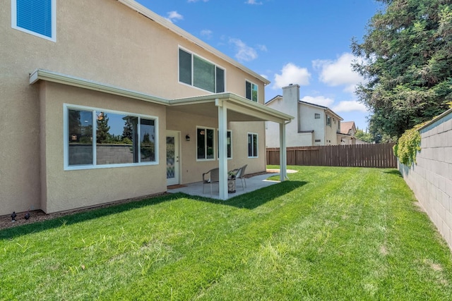 2234 E Serena Ave, Fresno, CA 93720 - rear view of house with a patio area, stucco siding, and a fenced backyard