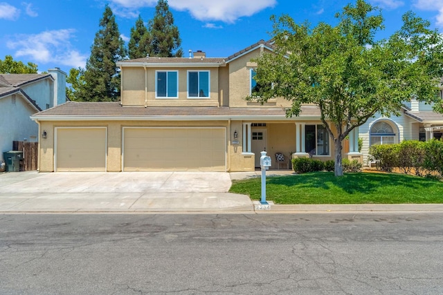 2234 E Serena Ave, Fresno, CA 93720 - traditional home featuring stucco siding, a front yard, concrete driveway, and an attached garage