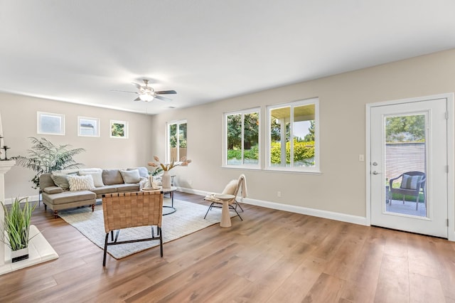 2234 E Serena Ave, Fresno, CA 93720 - living room with ceiling fan and light wood-style flooring