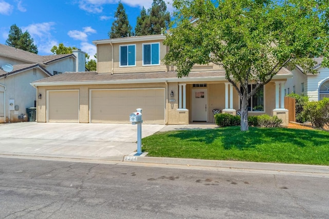 2234 E Serena Ave, Fresno, CA 93720 - view of front of home with driveway, stucco siding, a front yard, and an attached garage