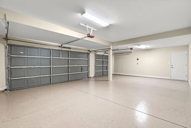 2234 E Serena Ave, Fresno, CA 93720 - garage featuring baseboards and a garage door opener