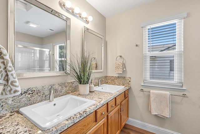 2234 E Serena Ave, Fresno, CA 93720 - full bath featuring double vanity, a shower with shower door, and wood finished floors