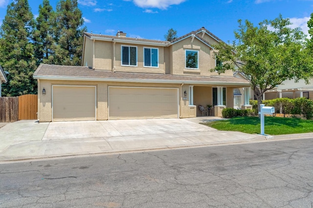 2234 E Serena Ave, Fresno, CA 93720 - traditional home with an attached garage, stucco siding, driveway, a chimney, and a tile roof