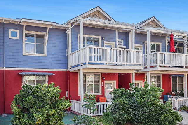 2658 E Alluvial Ave Unit 220, Fresno, CA 93720 - view of front facade with a pergola, a balcony, and stucco siding