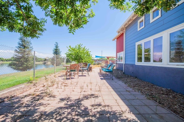 2658 E Alluvial Ave Unit 220, Fresno, CA 93720 - view of patio with outdoor dining area and a water view