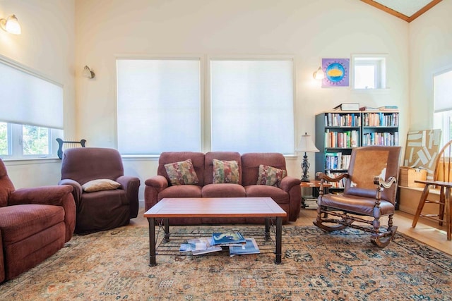 2658 E Alluvial Ave Unit 220, Fresno, CA 93720 - living room featuring vaulted ceiling, wood finished floors, and ornamental molding