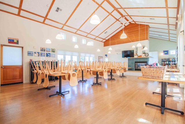 2658 E Alluvial Ave Unit 220, Fresno, CA 93720 - workout area featuring high vaulted ceiling, wood finished floors, and a fireplace