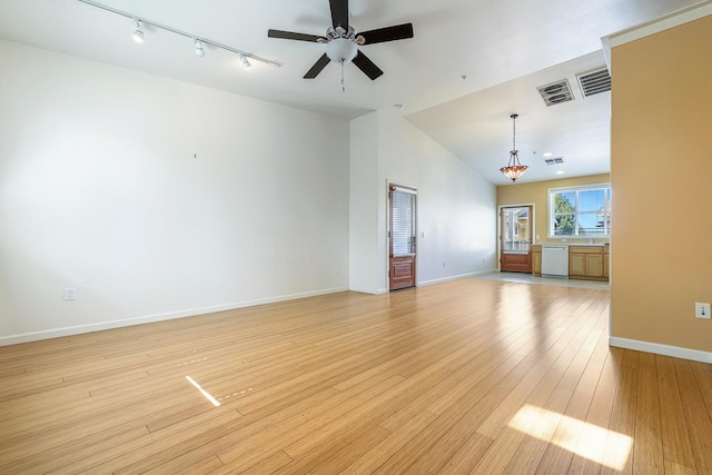 2658 E Alluvial Ave Unit 220, Fresno, CA 93720 - unfurnished living room with rail lighting, a ceiling fan, light wood-style flooring, and vaulted ceiling