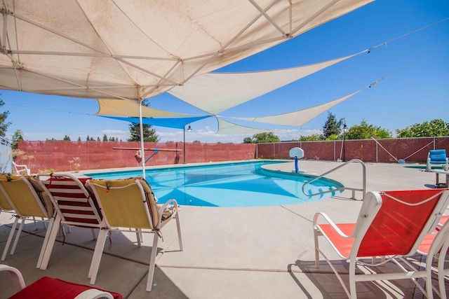 2658 E Alluvial Ave Unit 220, Fresno, CA 93720 - view of pool with a fenced backyard and a patio area