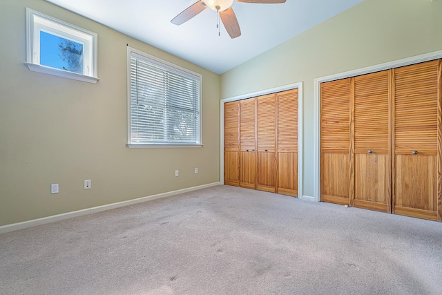 2658 E Alluvial Ave Unit 220, Fresno, CA 93720 - unfurnished bedroom featuring two closets, multiple windows, carpet flooring, and ceiling fan