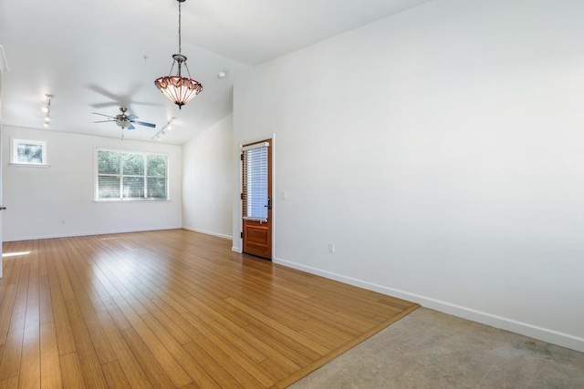 2658 E Alluvial Ave Unit 220, Fresno, CA 93720 - empty room featuring ceiling fan, vaulted ceiling, light wood-type flooring, and track lighting