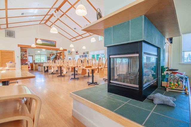 2658 E Alluvial Ave Unit 220, Fresno, CA 93720 - exercise room with wood finished floors, high vaulted ceiling, and beamed ceiling