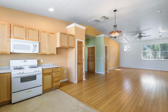 2658 E Alluvial Ave Unit 220, Fresno, CA 93720 - kitchen with white appliances, light brown cabinetry, vaulted ceiling, light countertops, and light wood-style floors