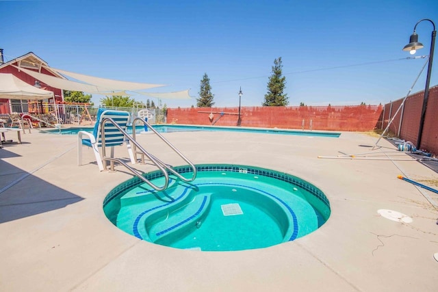 2658 E Alluvial Ave Unit 220, Fresno, CA 93720 - community pool featuring a fenced backyard, a patio, and a community hot tub