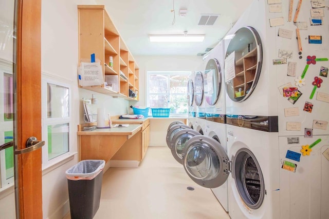 2658 E Alluvial Ave Unit 220, Fresno, CA 93720 - laundry room with stacked washer / dryer and an office area