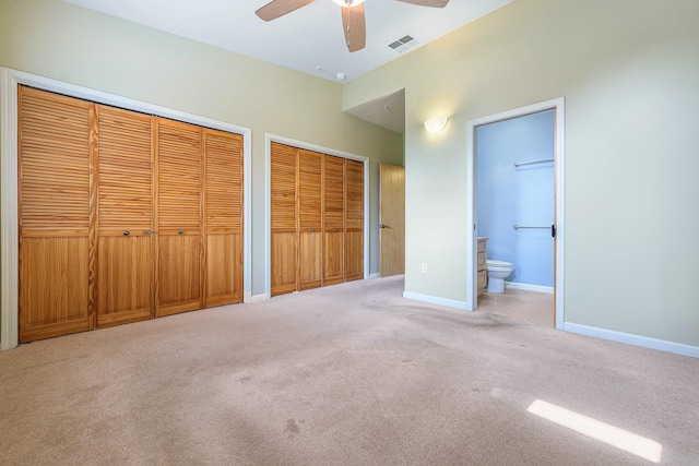 2658 E Alluvial Ave Unit 220, Fresno, CA 93720 - unfurnished bedroom with two closets, carpet, connected bathroom, and a ceiling fan