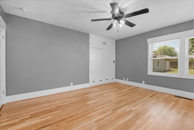 1461 N Harrison Ave, Fresno, CA 93728 - spare room featuring light wood-style floors and a ceiling fan